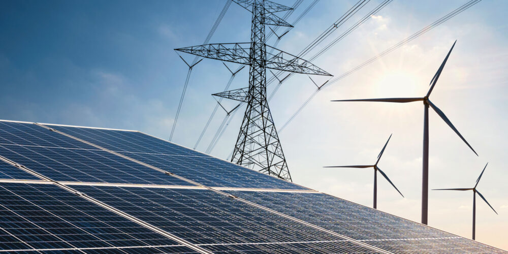 solar panels transmission pylons and wind turbines