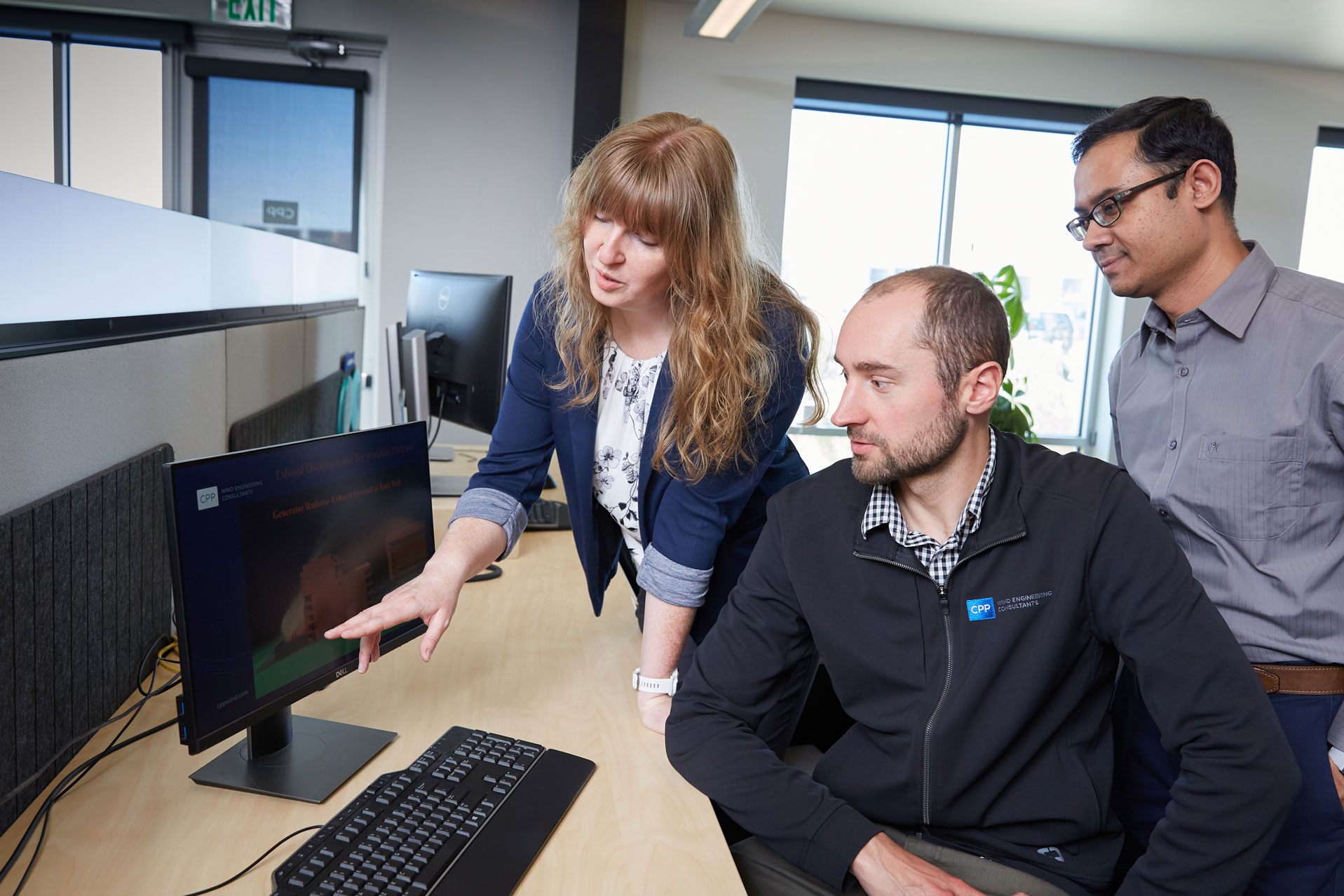 CPP-Wind-Engineering-IS3B1299-May-11-2022 Anke Collin and Jubayer looking at a report