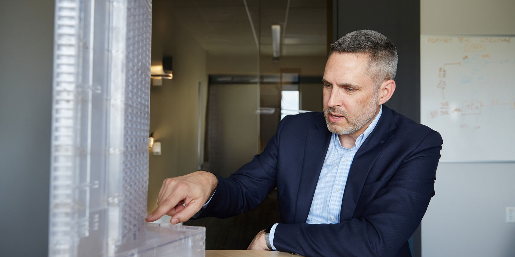 Jon Galsworthy with building model