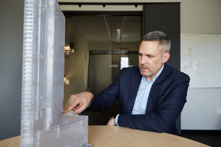 Jon Galsworthy with building model