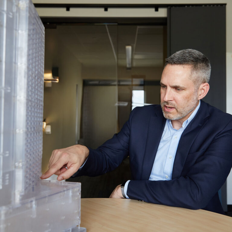 Jon Galsworthy with building model