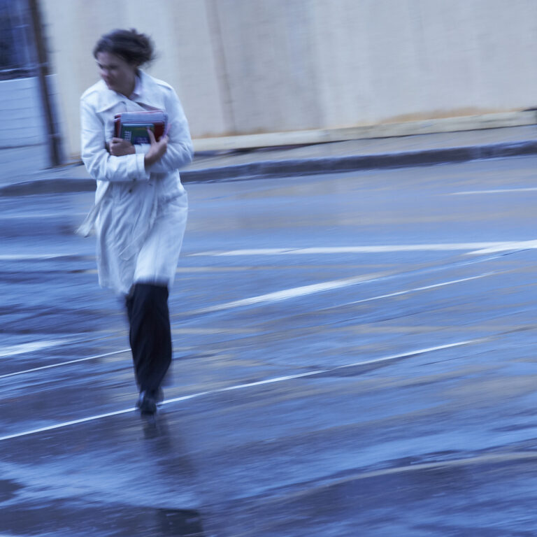 woman walking in the wind